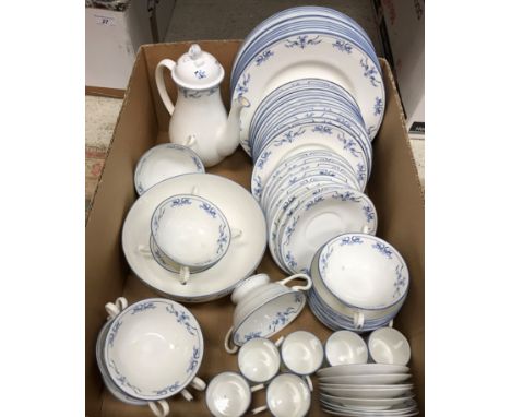 A Royal Worcester Petite Fleur blue smooth dinner service comprising eleven plates, twelve dessert plates, eight soup bowls a