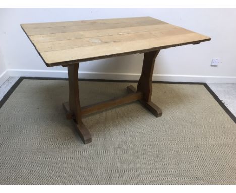 An oak refectory style kitchen table, the five plank top on plank end supports united by a centre stretcher, 122 cm long x 75