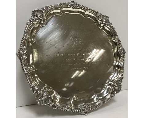 A mid 20th Century silver salver with shell and gadrooned edge, bearing inscription "Presented to Lieut Col J R Cleghorn DSO 