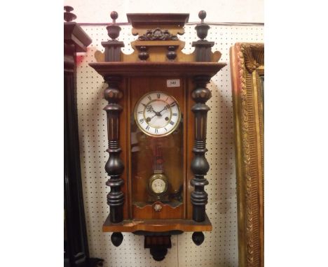 An early 20th Century Vienna regulator type wall clock with white enamel dial