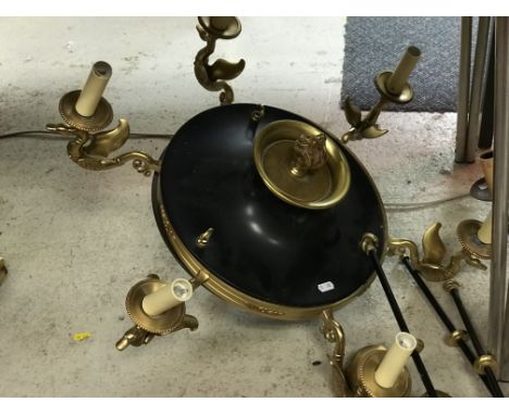 A brass and black painted metal six branch electrolier in the Empire style with swan decoration on each sconce approx. 69 cm 
