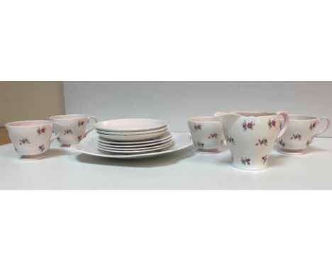 A Shelley "Charm" floral spray decorated pink ground part tea set comprising cream jug, four cups, three saucers, four plates