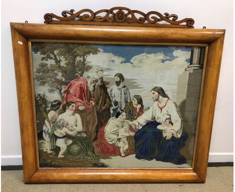 A Victorian maple veneered framed needlework tapestry of "Christ blessing children" (with old woodworm), needlework 92 cm x 1