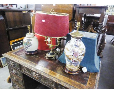 TWO LARGE ORIENTAL PORCELAIN VASE TABLE LAMPS ON HARDWOOD STANDS AND THE FABRIC SHADES AND A BRASS THREE LIGHT ELECTRIC TABLE