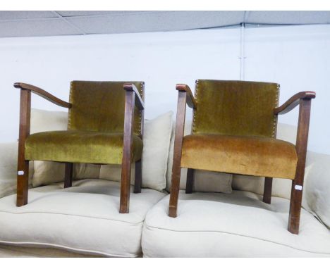 A PAIR OF OAK LADDER BACK DINING CHAIRS AND A PAIR OF BEECHWOOD LOW SEATED EASY ARMCHAIRS, THE UPHOLSTERED CURVED PANEL BACKS
