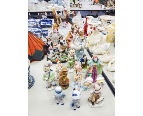 QUANTITY OF CERAMIC FIGURES, ONE WITH CHILDREN PLAYING IN A TREE, TWO STAFFORDSHIRE MODELS OF DOGS, CLOWNS ETC.... 