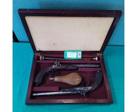 A pair of French percussion rifled target pistols, each approx 17" overall with 10 3/4" barrels of approx 62 bore, housed wit