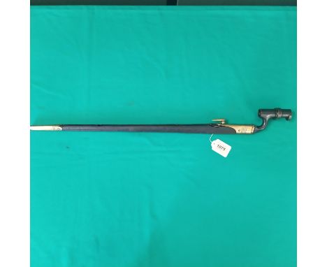 A British model 1876 socket bayonet with a brass mounted leather scabbard (scabbard as found)