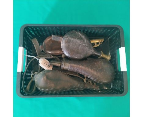 Three leather shot flasks (one as found) with a leather covered 'Hawksley' powder flask (spring as found)
