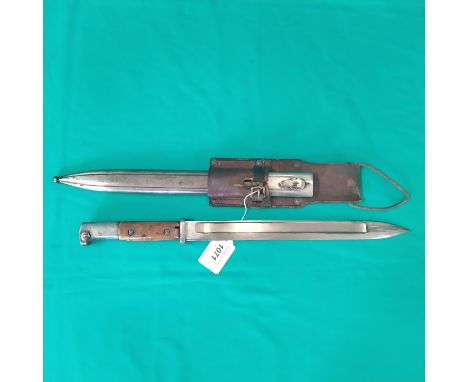 A German WWI era model 1914 bayonet by Bayard with scabbard and leather frog (retaining strap on frog as found)