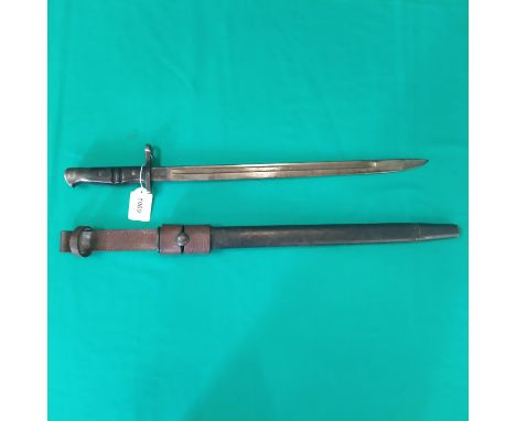 A Remington model 1913 bayonet with scabbard and leather frog