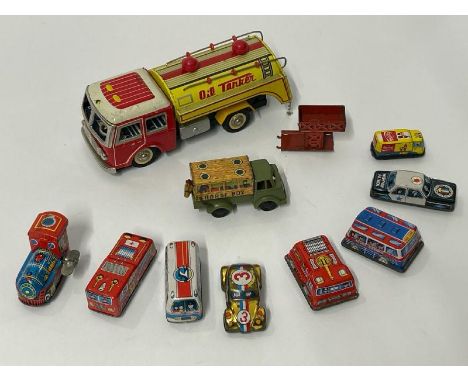 Vintage tinplate friction oil tanker and nine small vintage tinplate vehicles including fire engine and truck with horse box 