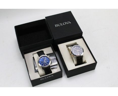 Two boxed Bulova chronograph gents wristwatches. One with blue dial and black leather strap, the other with a black dial and 