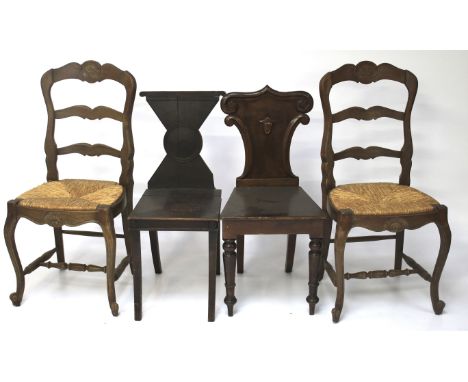 Two Georgian style oak hall chairs and two French 18th century style rush dining chairs.  The first hall chair with scroll-ed