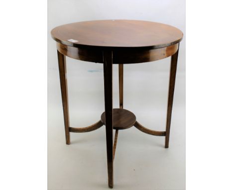 A Georgian style mahogany occasional table of circular form. Inlaid with checkered stringing, with lower circular shelf joine