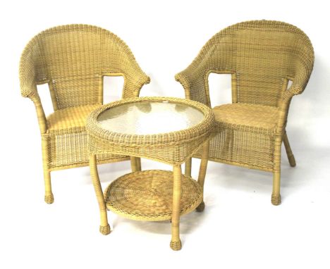 A set of two wicker chairs and a table. The chairs with scroll arms, H90cm, the table of circular form with a textured temper