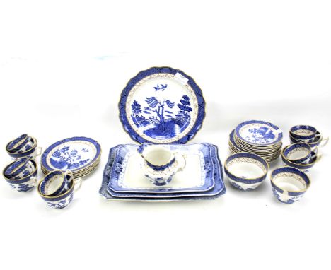 A Booths Real Old Willow pattern blue and white part ceramic tea service. To include tea cups, saucers, etc