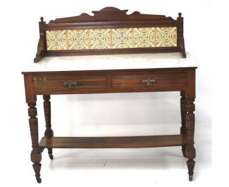 An early 20th century marble topped wash stand. The upper mahogany frame set with six decorative tiles, the lower section wit