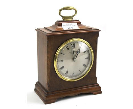 A Hampton & Sons (Pall Mall East) walnut veneered bracket clock. Early 20th century, with silvered dial and black Roman numer