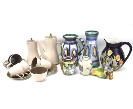 An assortment of ceramics. Including a Poole Pottery part tea and coffee service in pink and brown, two pieces of Tintagel Po