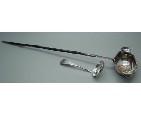 A silver sifter spoon, 23g, and a toddy ladle inset with a George III silver coin and with baleen handle