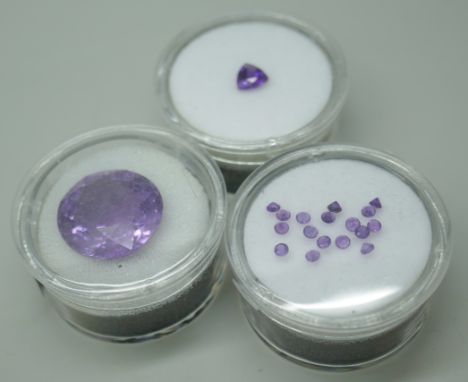 A 15mm purple stone with a trillion cut amethyst and small round amethysts 