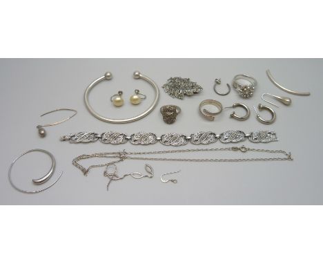 A collection of silver and other jewellery, torque bangle, rings, etc.