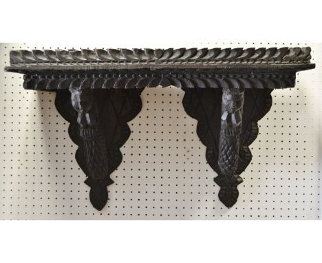 A Jacobean revival carved wall shelf