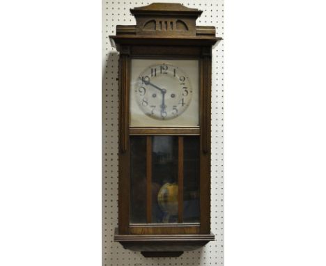 A 1940'S oak wall clock, silvered dial, Arabic numerals