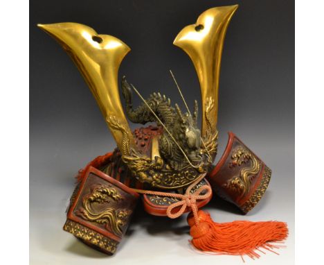 A reproduction Kuwagata Kabute Samurai helmet, surmounted with a dragon, Hokusai style wave decorated panels, vibrant ochre t