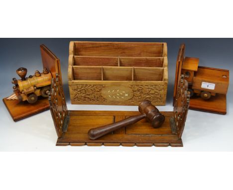 A Victorian oak extendable book rack, carved and pierced Gothic ends; a 20th century Indian sandalwood letter rack; a steam e