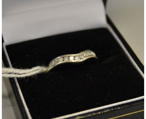 A diamond wishbone eternity ring 9 diamonds, 9ct white gold