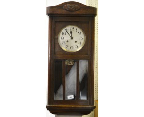 A 1940's oak wall clock