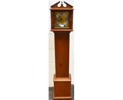 A mahogany grandmother clock, Hermle eight day movement, brass dial and spandrels, silvered chapter ring, Roman numerals.