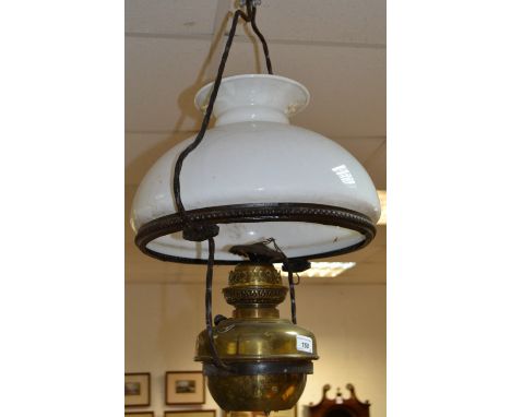 A Victorian hanging oil lamp with opaque glass shade