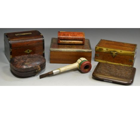 A Victorian leather bound pipe case; a heavily carved folding cigarette case; a cigarette box with white metal bound tapestry