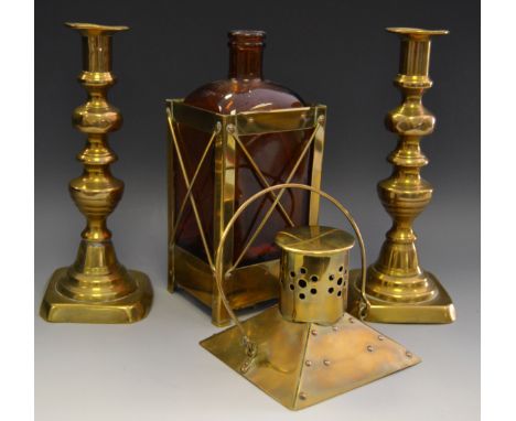 A novelty musical decanter in the form of brass mounted lantern; a pair of George III ejector candlesticks;  Andre-Marie D'Ar