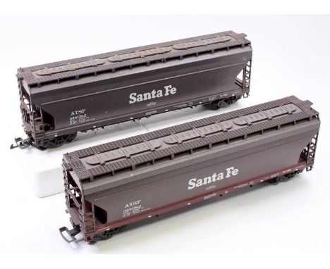 A pair of LGB G scale Santa Fe centre-flow hopper wagons, both finished in brown and numbered 314082 to sides