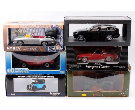 A collection of six various boxed 1/18 scale diecast vehicles to include an ERTL Mercedes Benz 190 SL coupe, a Ricko Austin 7