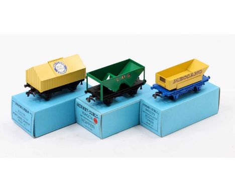 Three wagons: LMS hopper, green; yellow cement ‘Blue Circle’; ‘Meccano’ rotary tipper.