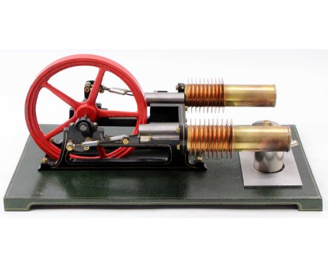 Roland Reichelt stationary horizontal hot air engine, comprising twin cylinders with twin heat exchangers, powering a central