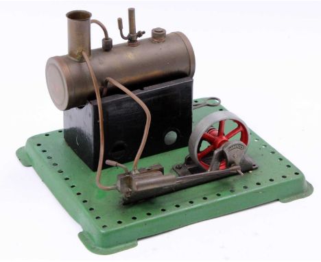 Mamod Stationary steam plant, comprising of a horizontal boiler powering a single-cylinder mill engine, raised on meccano sty