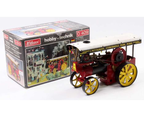 Wilesco D409 Showmans Engine, Live Steam, finished in red and black with corrugated canopy to read "T.Pettigrove, Stonebridge