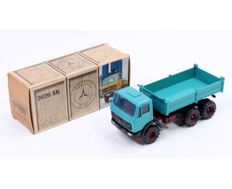 A Gesha 1/50 scale model of a 2626AK Mercedes Benz tipper truck comprising of maroon chassis with blue cab and back, housed i