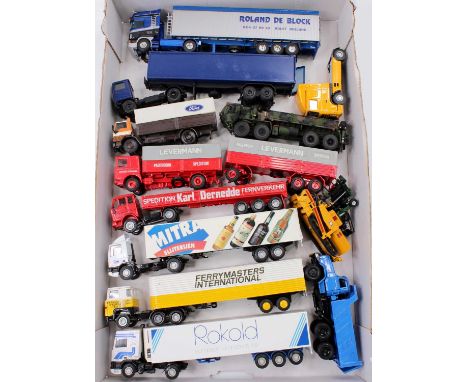 A tray of mixed modern issue 1/50th scale trucks, with examples including a Lion Cars Scania 140 in Ferrymasters livery, an N