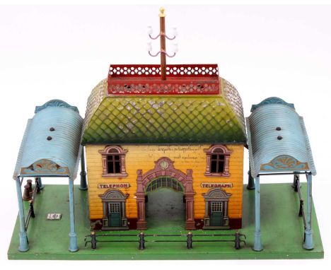 A Bing tinplate early 20th century City station comprising of brickwork effect lithograph printed building with telephone and