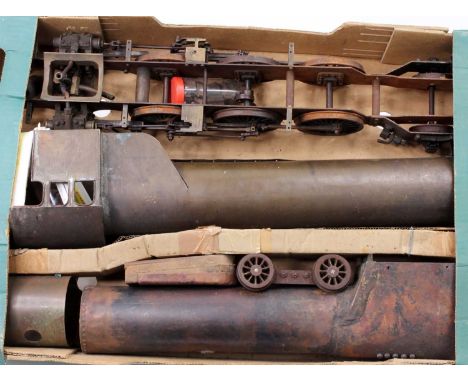 4 trays of mixed steam spares, part built chassis frames, traction engine wheels, trailing wheels and other associated live s