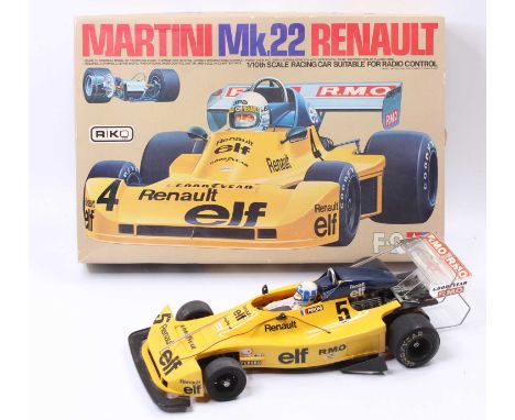 A Tamiya 1/10th scale Martini Mk22 Renault radio-controlled version, a built model with the original box and various accessor