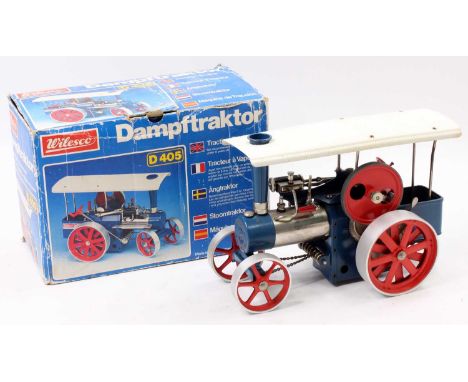A Wilesco No. D405 Traction Engine comprising of blue &amp; red body housed in the original pictorial sided card box, some us