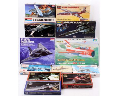 A box containing 12 mixed aircraft kits with examples including a Revell 1/72nd scale SR-71 Spy Plane, an Academy Hobby Model